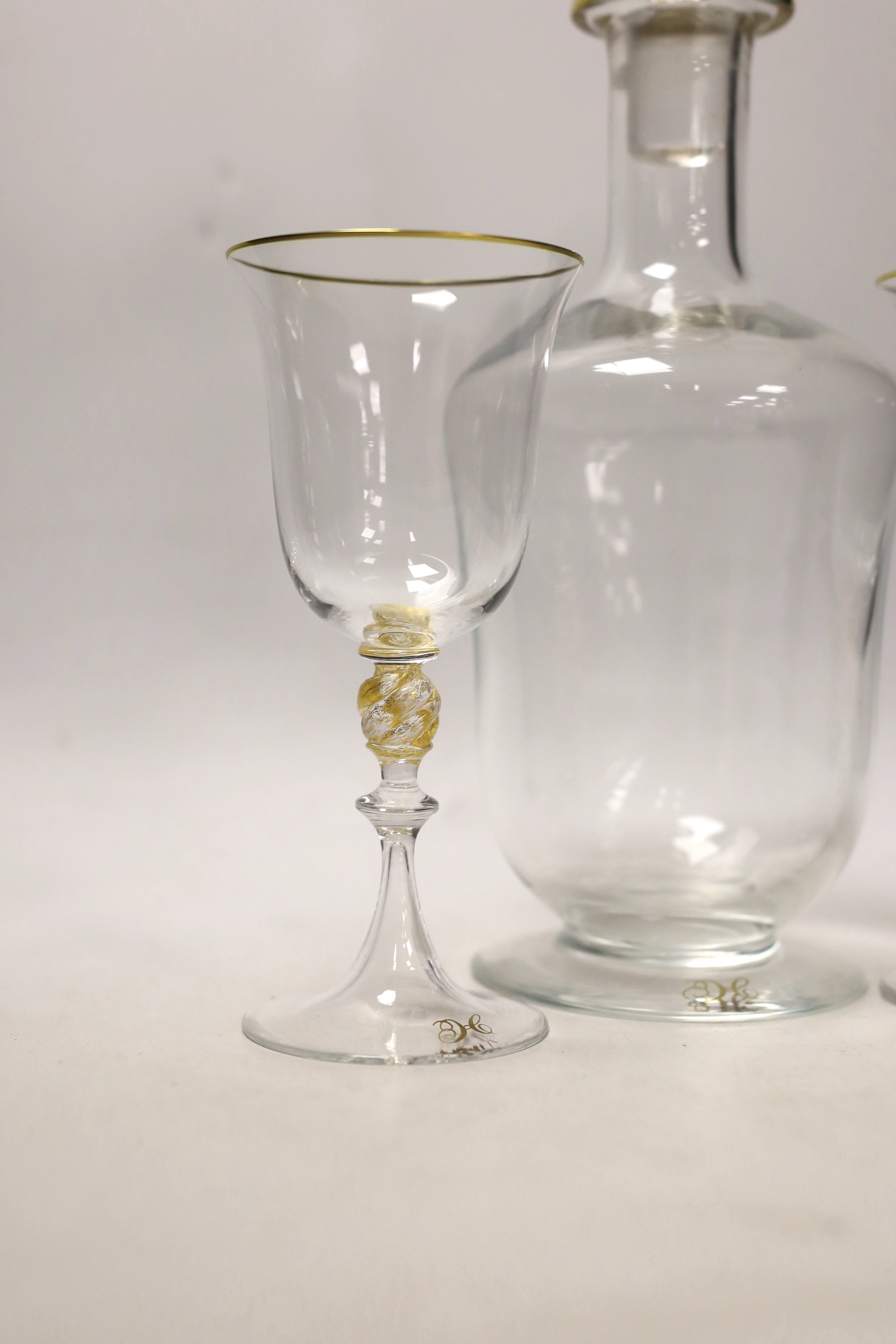 A Venetian glass decanter and two matching glasses, each with a gilt ‘H’ to foot. Tallest 32cm